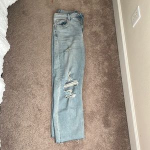 Barley worn. Highest rise, straight jeans. With rips size 10